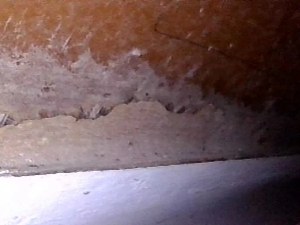 Area of delamination on the hull; signs of separation in the laminate